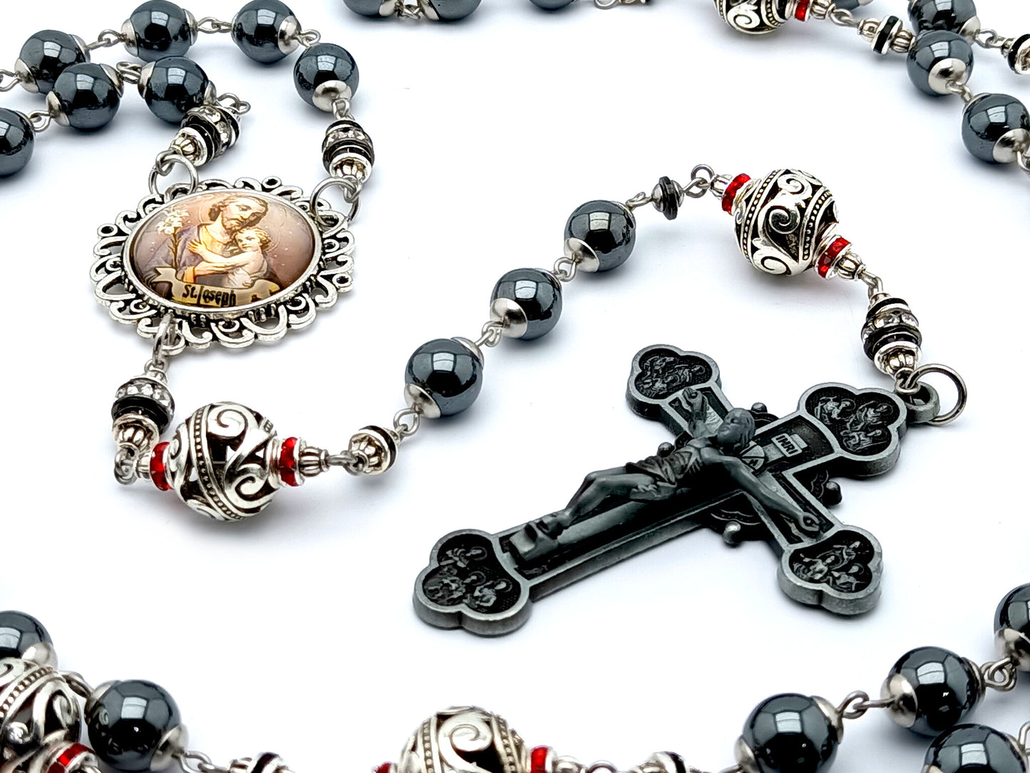 Saint Joseph hematite and silver rosary beads with twelve apostles pewter crucifix.