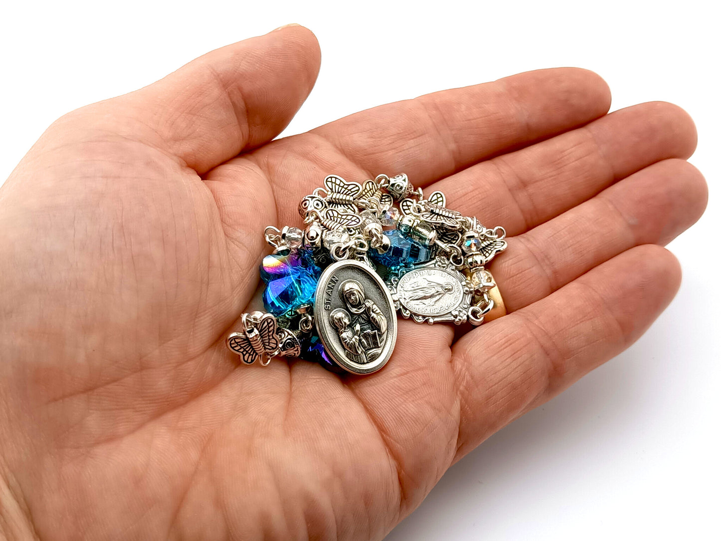 Saint Ann unique rosary beads prayer chaplet with silver butterfly and blue crystal beads, Miraculous medal centre and Saint Ann end medal.