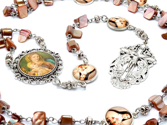 Virgin and Child Jesus unique rosary beads with pink shell beads and Saint Therese of Lisieux linking medals and a Holy angel crucifix.
