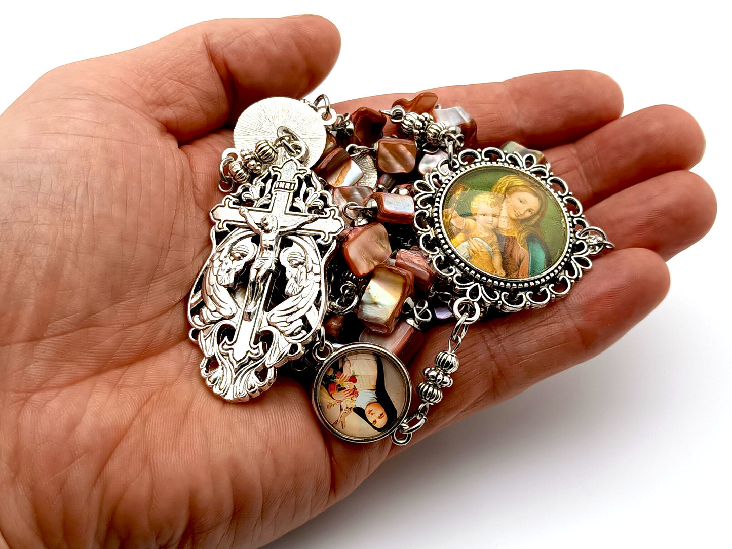 Virgin and Child Jesus unique rosary beads with pink shell beads and Saint Therese of Lisieux linking medals and a Holy angel crucifix.
