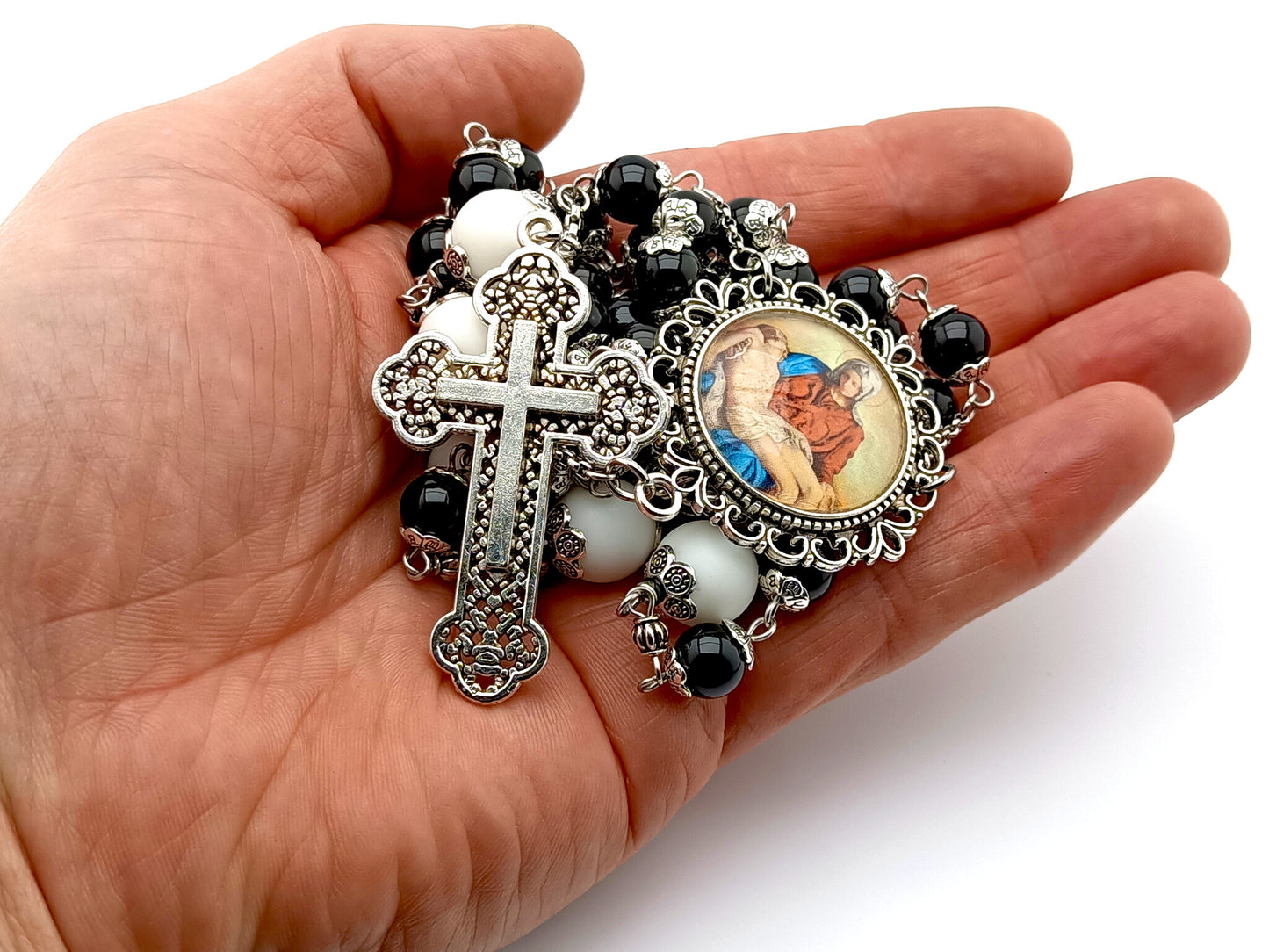 La Pieta unique rosary beads with onyx and alabaster beads, filigree cross and picture medal.