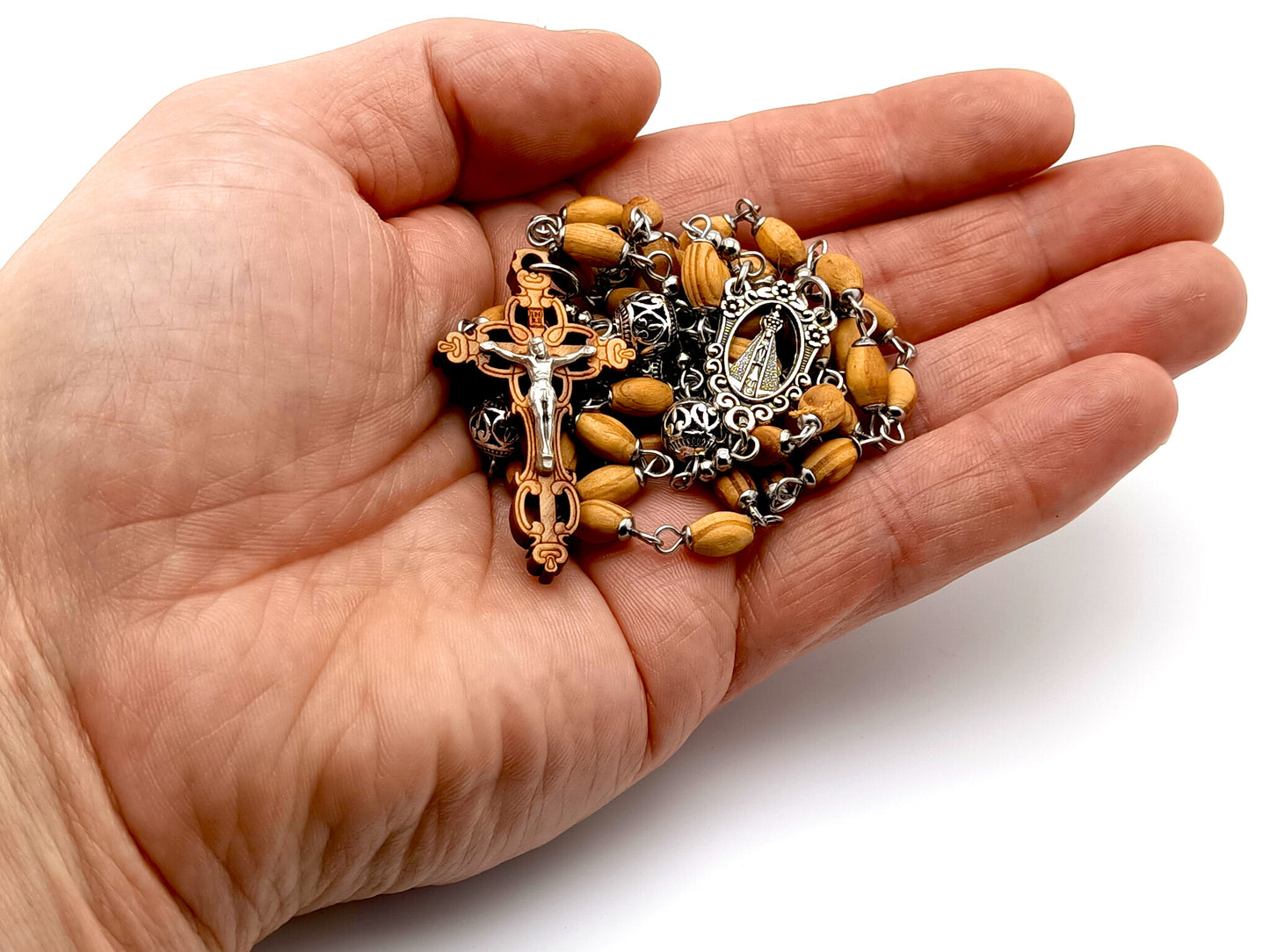 Our Lady of Charity unique rosary beads with wooden and Tibetan silver beads and Jerusalem olive wood laser cut crucifix.