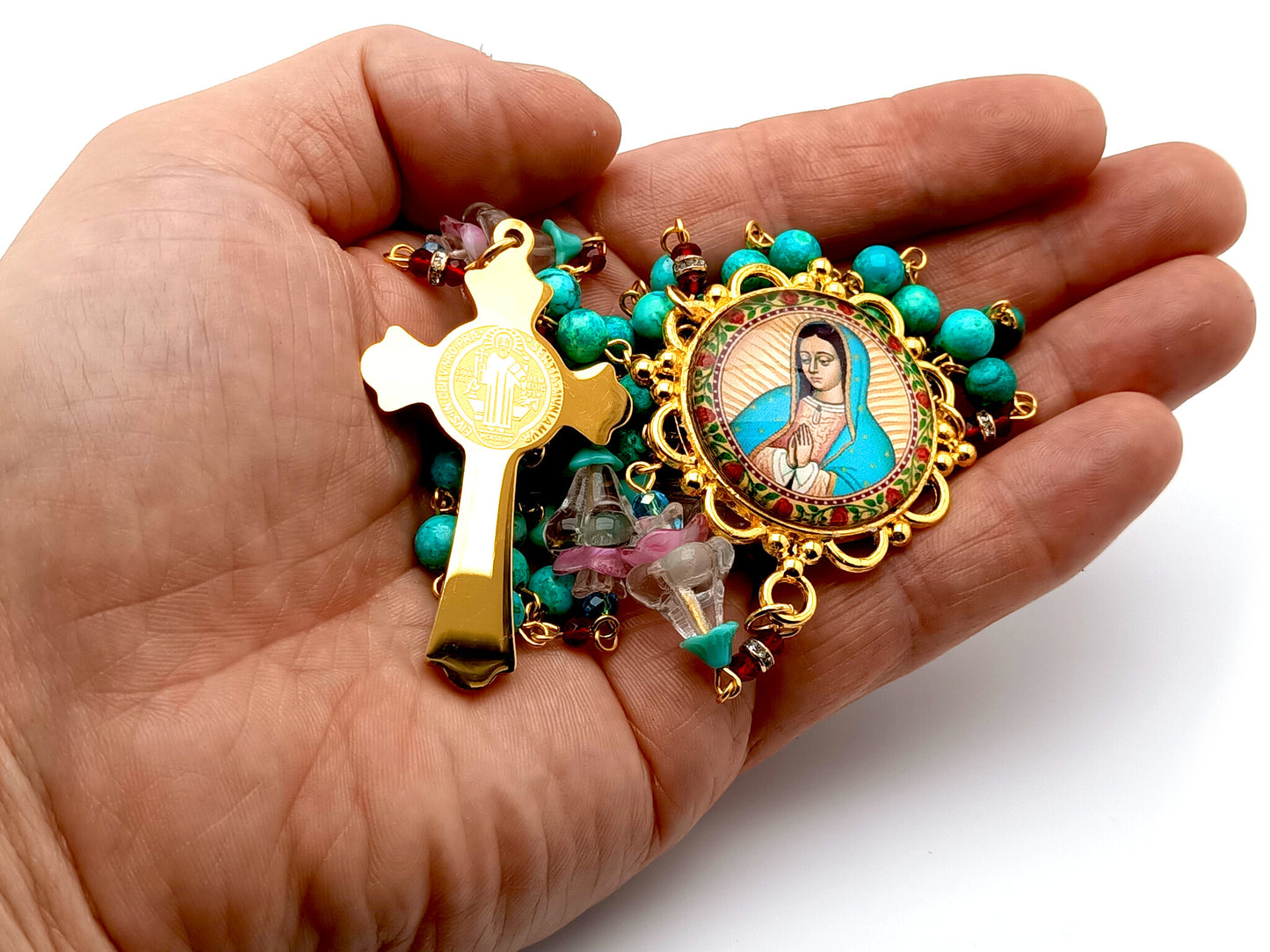 Our Lady of Guadalupe unique rosary beads with turquoise gemstone and glass flowers beads and gold and black enamel Saint Benedict crucifix.
