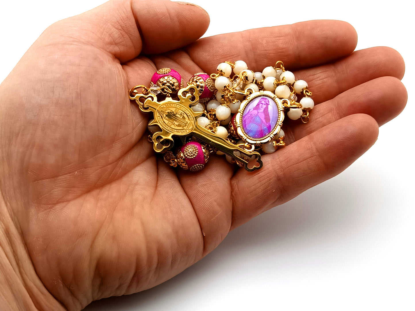 Saint Philomena unique rosary beads mother of pearl rosary beads with Saint Benedict gold plated stainless steel crucifix and pink enamel Our Father beads.