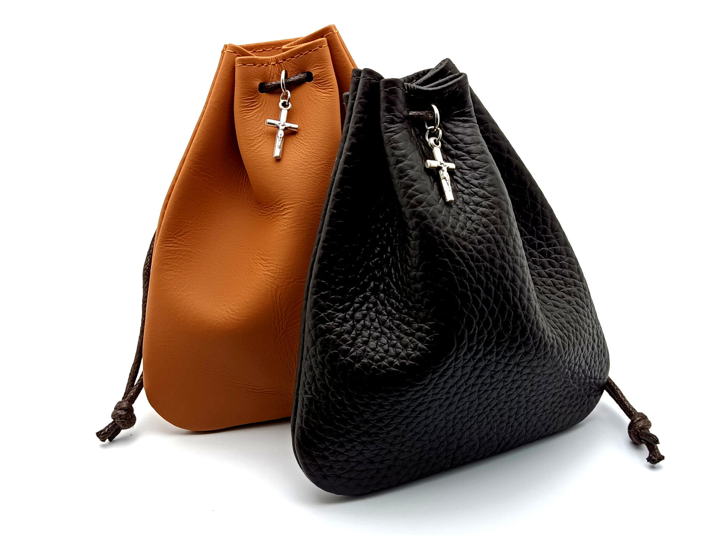 Real leather rosary pouch with draw string and small crucifix in tan and dark brown.