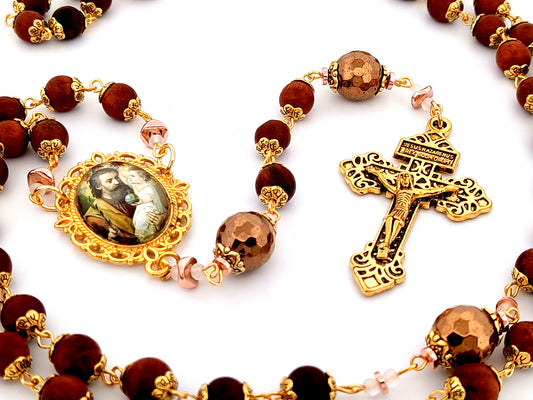 Saint Joseph and child Jesus unique rosary beads dark olive wood rosary with gold plated Pardon crucifix.