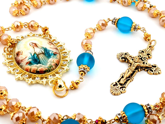 Assumption of Our Lady unique rosary beads rose gold faceted and blue glass beads with gold plated filigree crucifix.