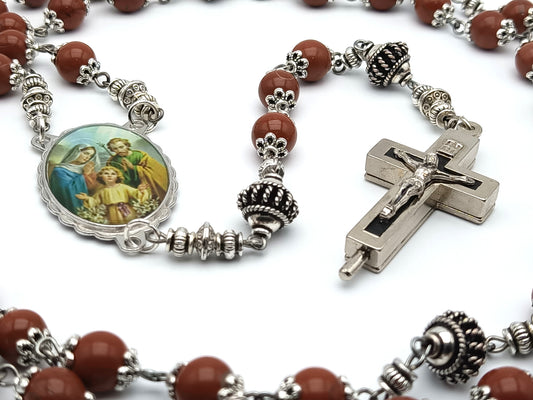 Holy Family unique rosary beads with brown gemstone beads, reliquary crucifix, silver pater beads, and picture centre medal.