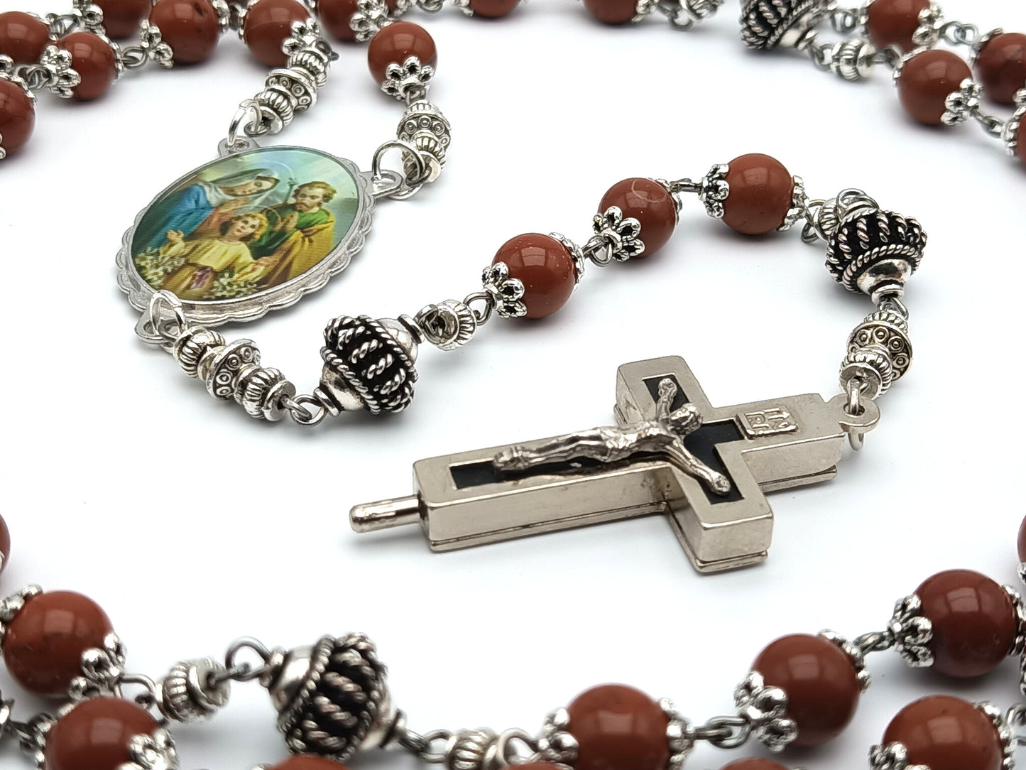 Holy Family unique rosary beads with brown gemstone beads, reliquary crucifix, silver pater beads, and picture centre medal.