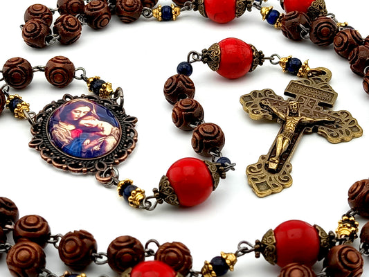 Our Lady of Divine Providence dark wood and red howlite rosary beads with Pardon Crucifix.