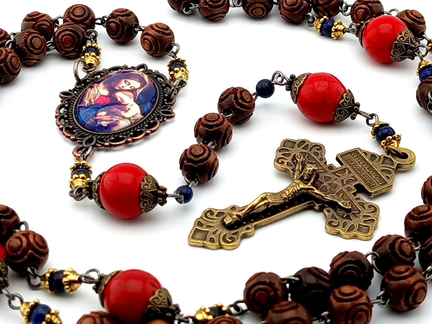 Our Lady of Divine Providence dark wood and red howlite rosary beads with Pardon Crucifix.