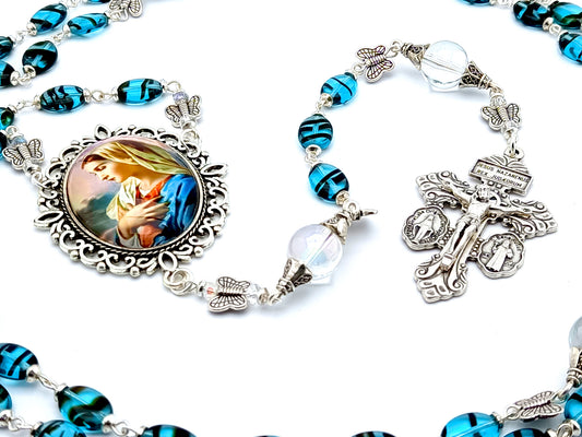 Virgin Marys Fiat unique rosary beads with blue oval glass beads, silver butterfly beads, silver pardon crucifix and picture centre medal.