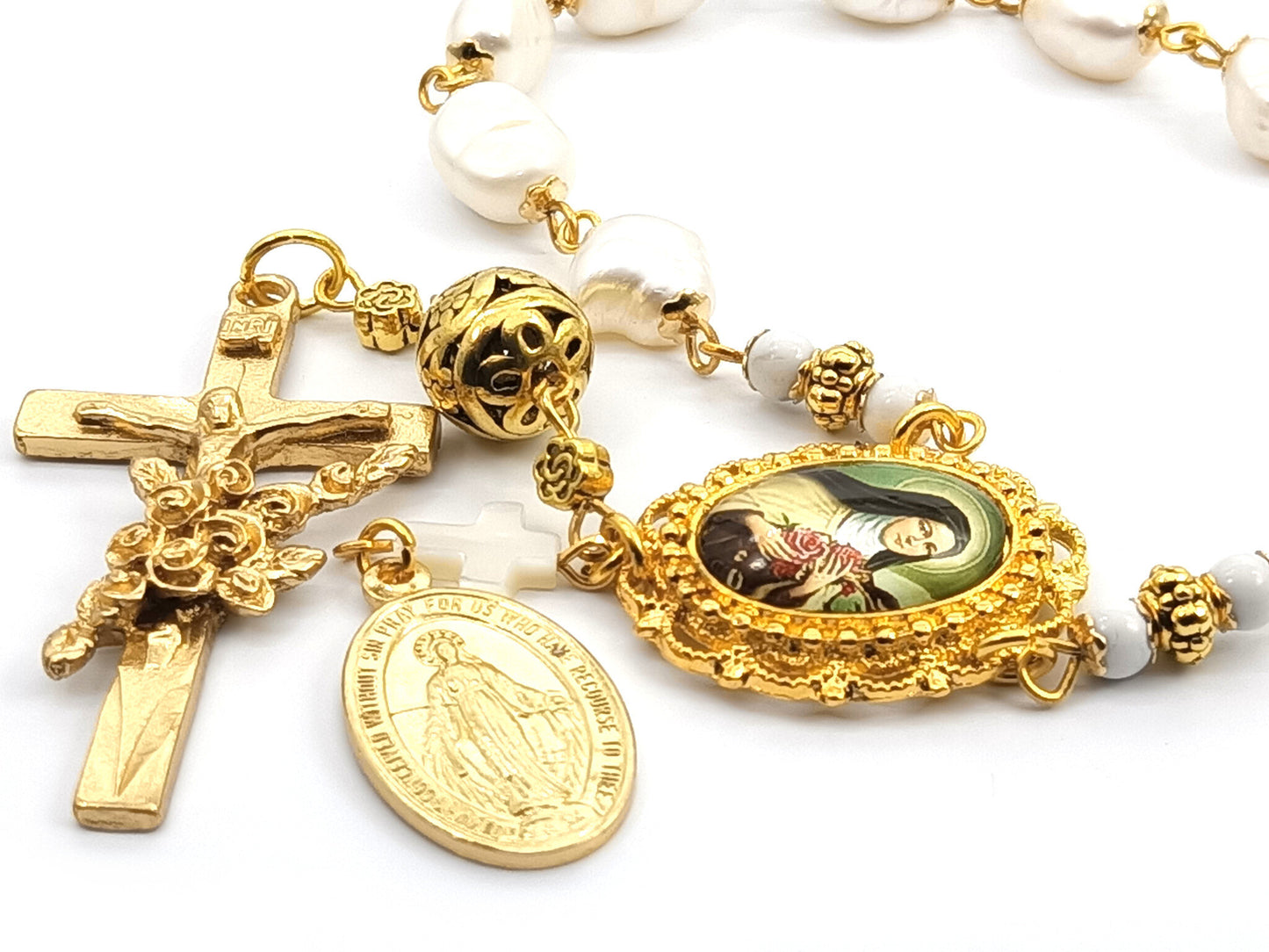 Genuine pearl unique rosary beads single decade with gold crucifix, miraculous medal and Saint Therese of Lisieux picture medal.
