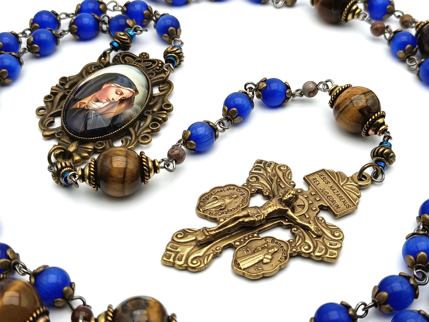 Our Lady of Sorrows unique rosary beads with blue glass and tigers eye gemstone beads, bronze pardon crucifix and picture centre medal.