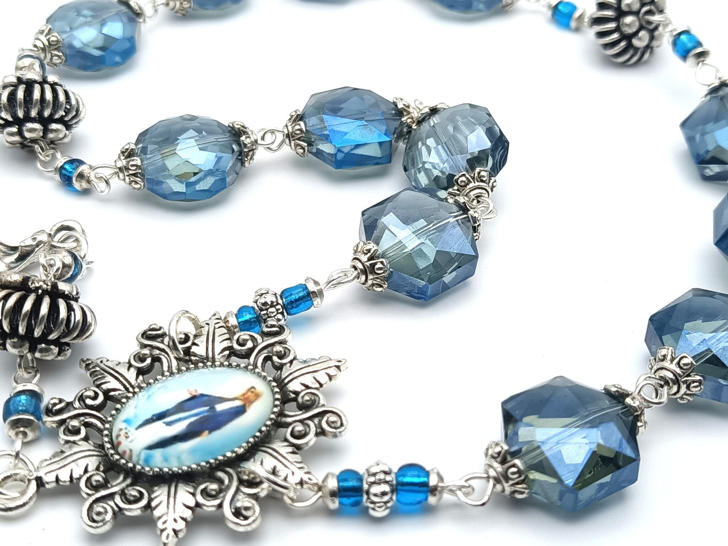 Immaculate Conception unique rosary beads prayer chaplet with blue faceted crystal beads, silver picture centre medal and statue medal of Our Lady.