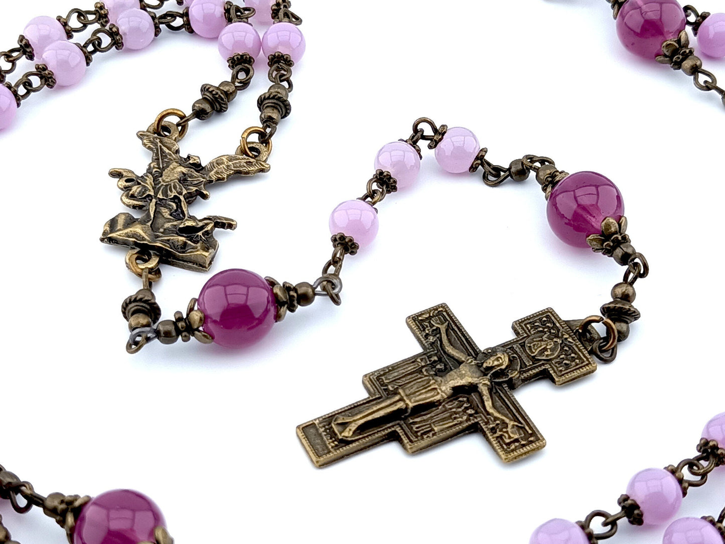 Saint Michael the Archangel unique rosary beads with pink glass beads, bronze Saint Francis crucifix, centre medal and bead caps.