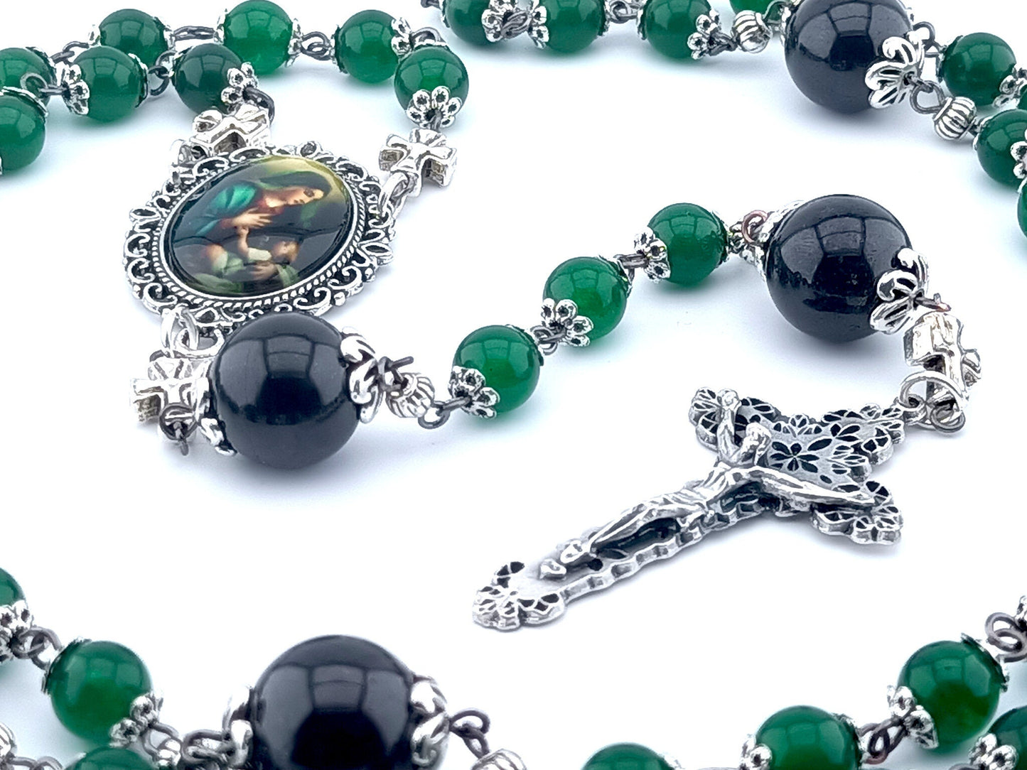 The Nativity unique rosary beads with green jasper gemstone beads, silver crucifix and picture centre medal, large garnet pater beads and silver bead caps and cross linking beads.