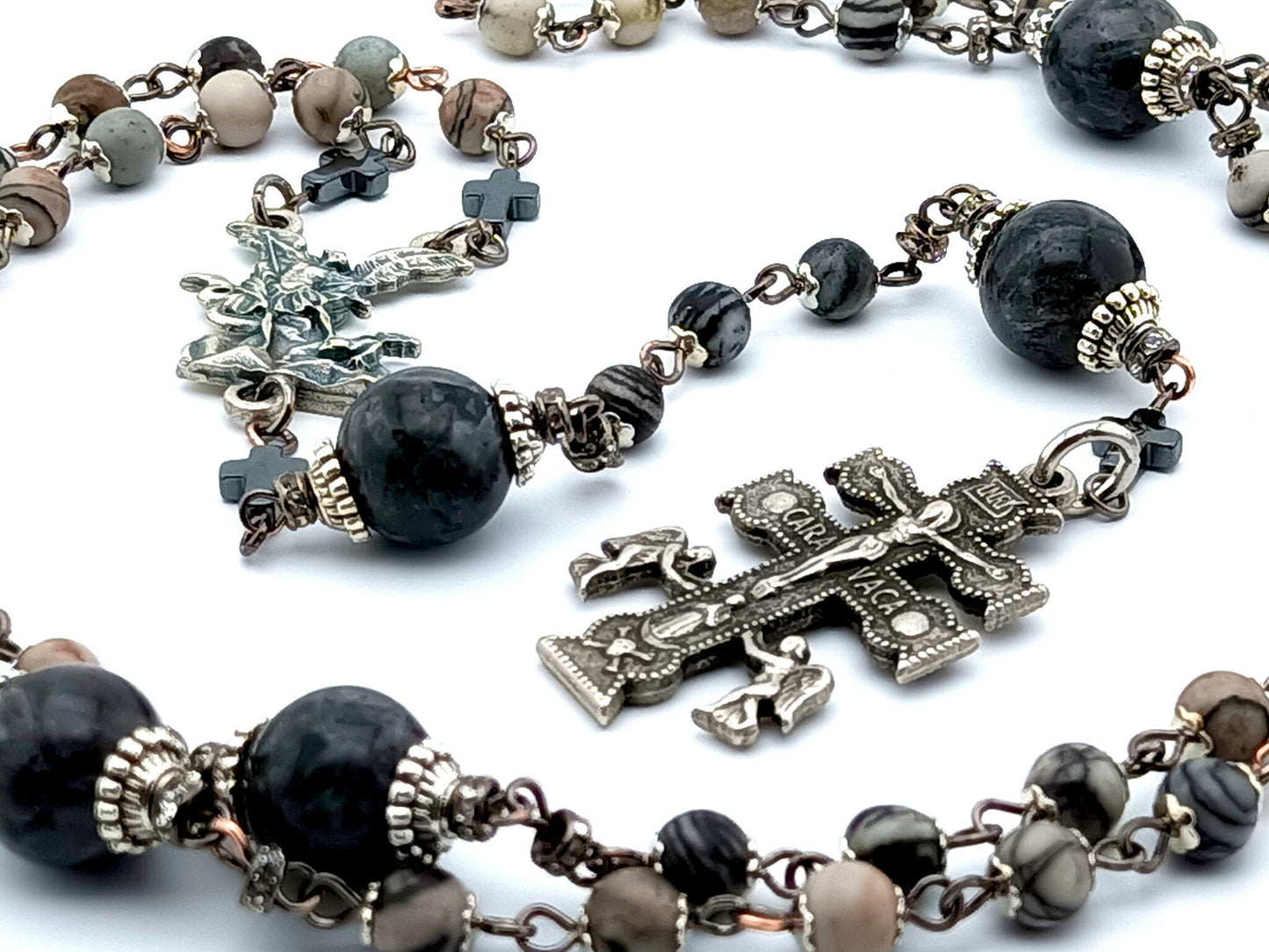 Saint Michael unique rosary beads with labradorite gemstone beads, Caravaca crucifix, metal centre medal and large veined black jade pater beads.
