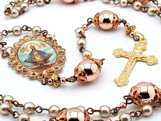 Our Lady of Charity unique rosary beads with rose gold hematite beads, golden Holy Trinity crucifix and picture centre medal.