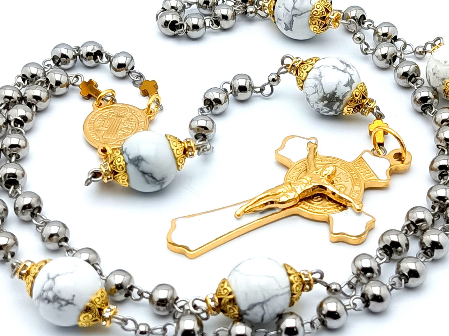 Saint Benedict unique rosary beads with stainless steel and white beads, stainless steel gold plated and white enamel crucifix and gold plated stainless steel centre medal.