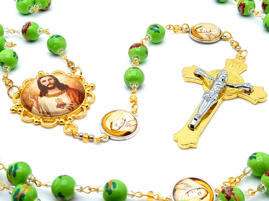 Sacred Heart of Jesus unique rosary beads with floral porcelain and the Virgin Mary linking medal beads and gold Saint Benedict crucifix.