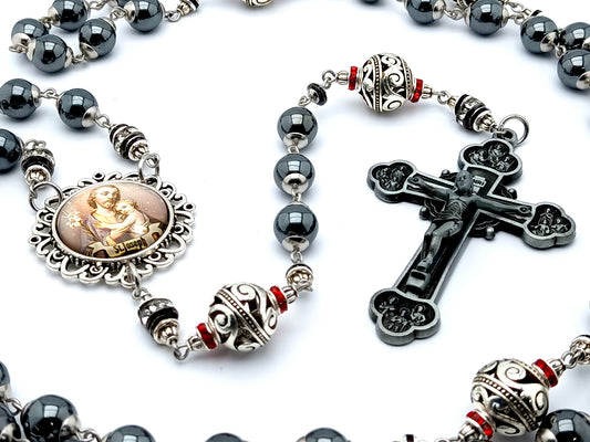 Saint Joseph hematite and silver rosary beads with twelve apostles pewter crucifix.