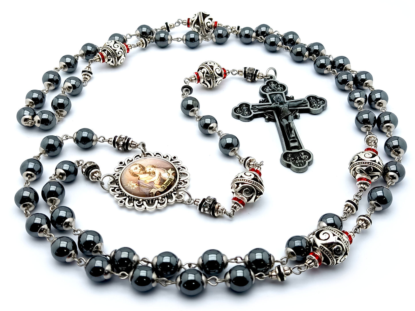 Saint Joseph hematite and silver rosary beads with twelve apostles pewter crucifix.