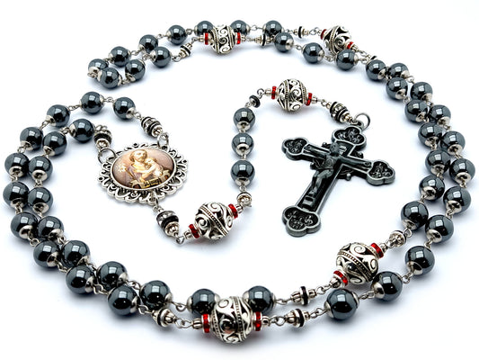 Saint Joseph hematite and silver rosary beads with twelve apostles pewter crucifix.