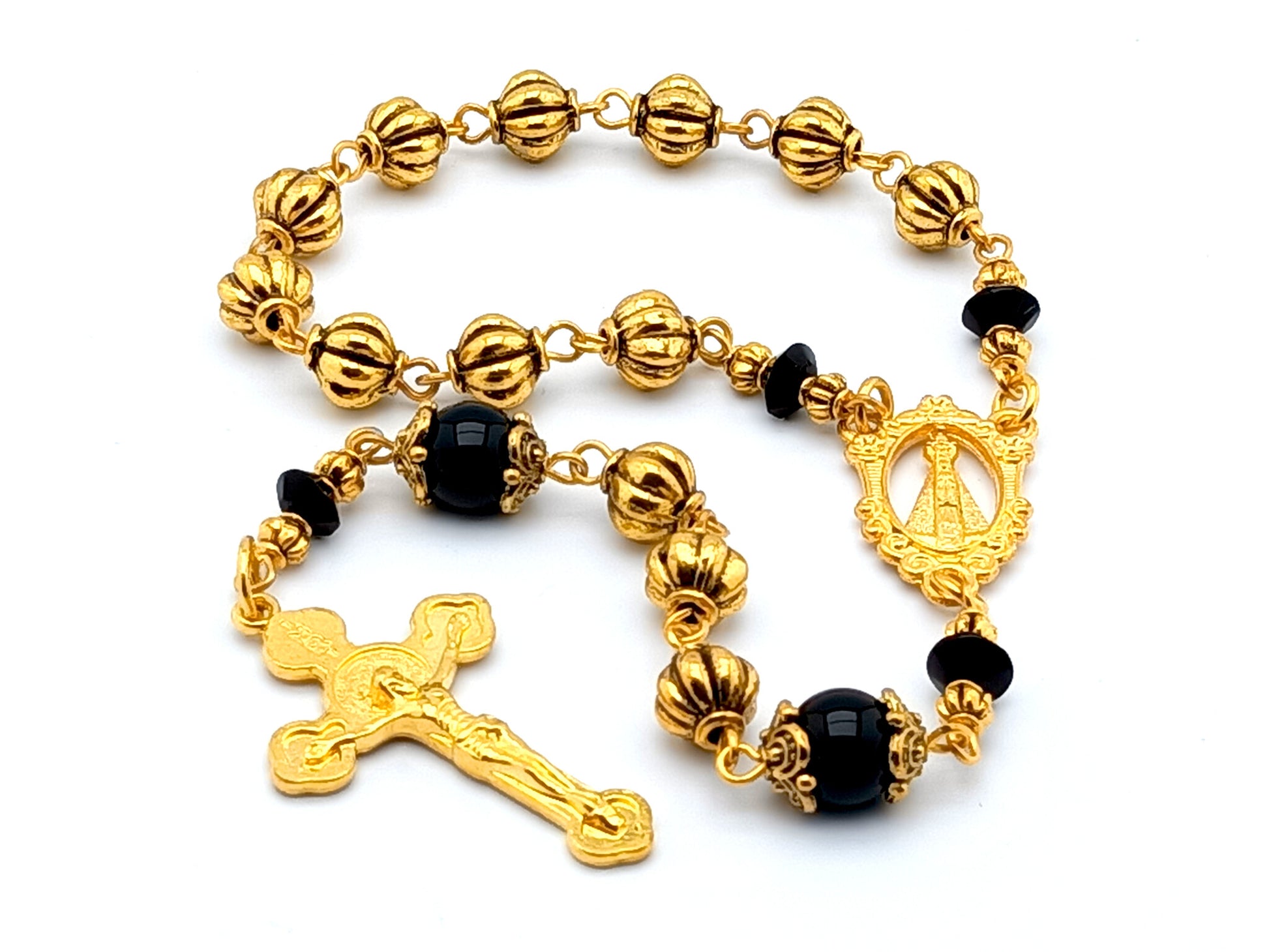 Our Lady of Loretto unique rosary beads single decade rosary with onyx and gold pumpkin beads, gold centre medal and Saint Benedict crucifix.