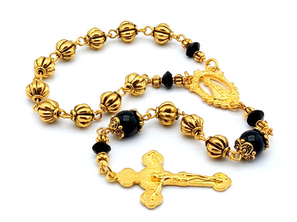 Our Lady of Loretto unique rosary beads single decade rosary with onyx and gold pumpkin beads, gold centre medal and Saint Benedict crucifix.