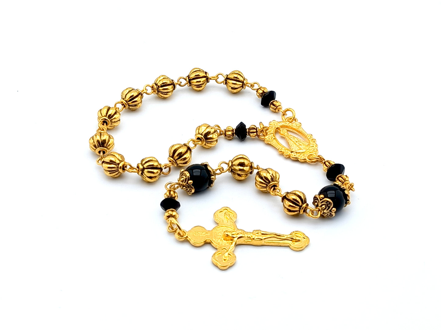 Our Lady of Loretto unique rosary beads single decade rosary with onyx and gold pumpkin beads, gold centre medal and Saint Benedict crucifix.