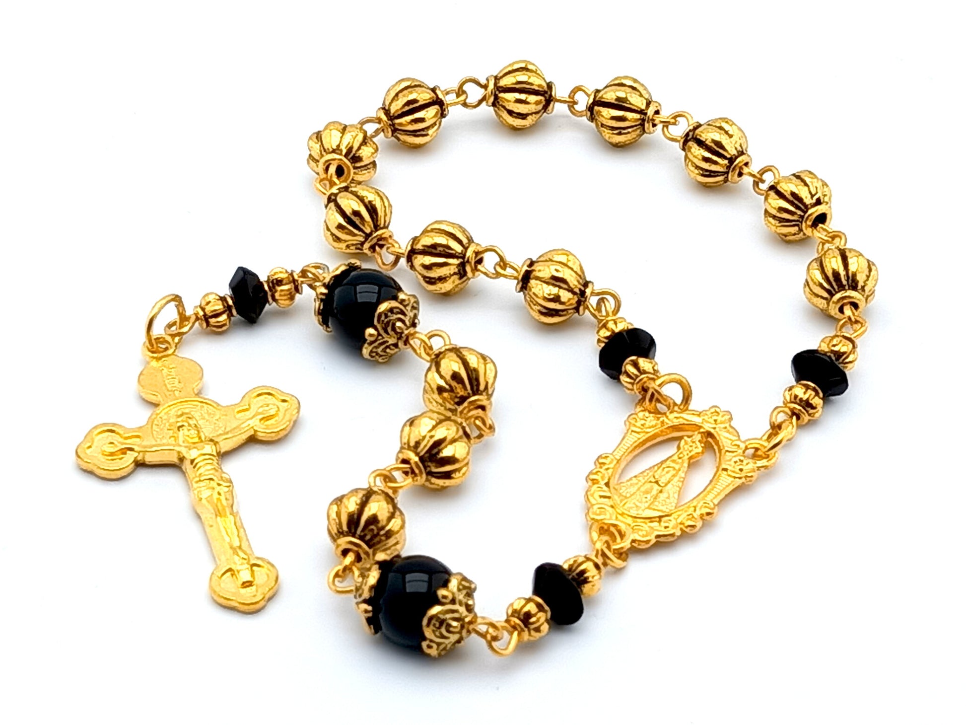 Our Lady of Loretto unique rosary beads single decade rosary with onyx and gold pumpkin beads, gold centre medal and Saint Benedict crucifix.