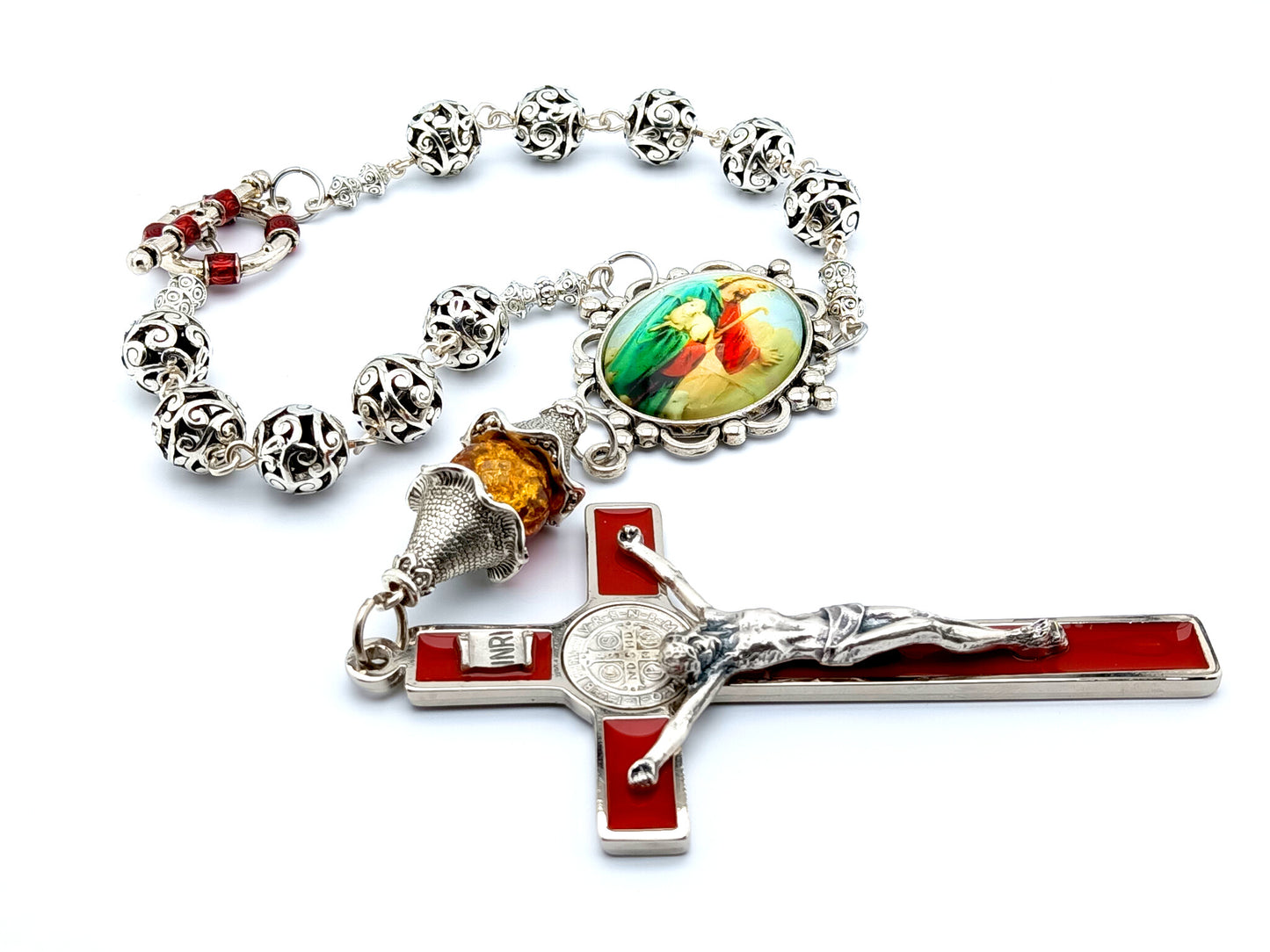 Large red enamel Saint Benedict wall crucifix and single decade Jesus the good Shepard Tibetan silver rosary.