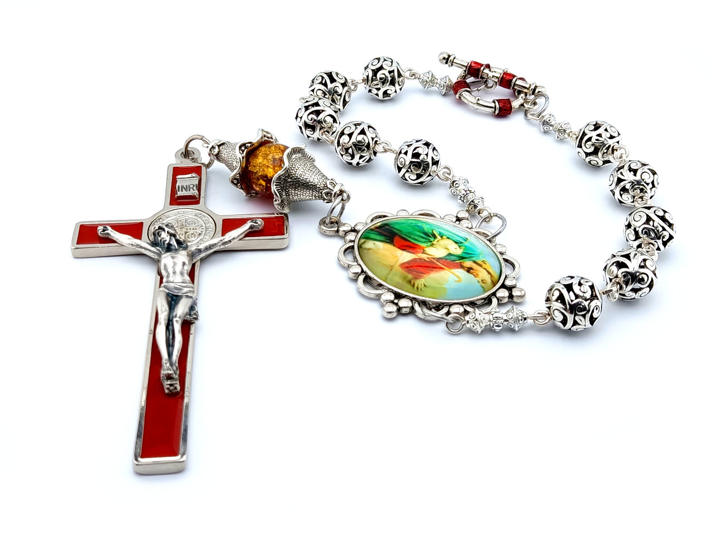 Large red enamel Saint Benedict wall crucifix and single decade Jesus the good Shepard Tibetan silver rosary.