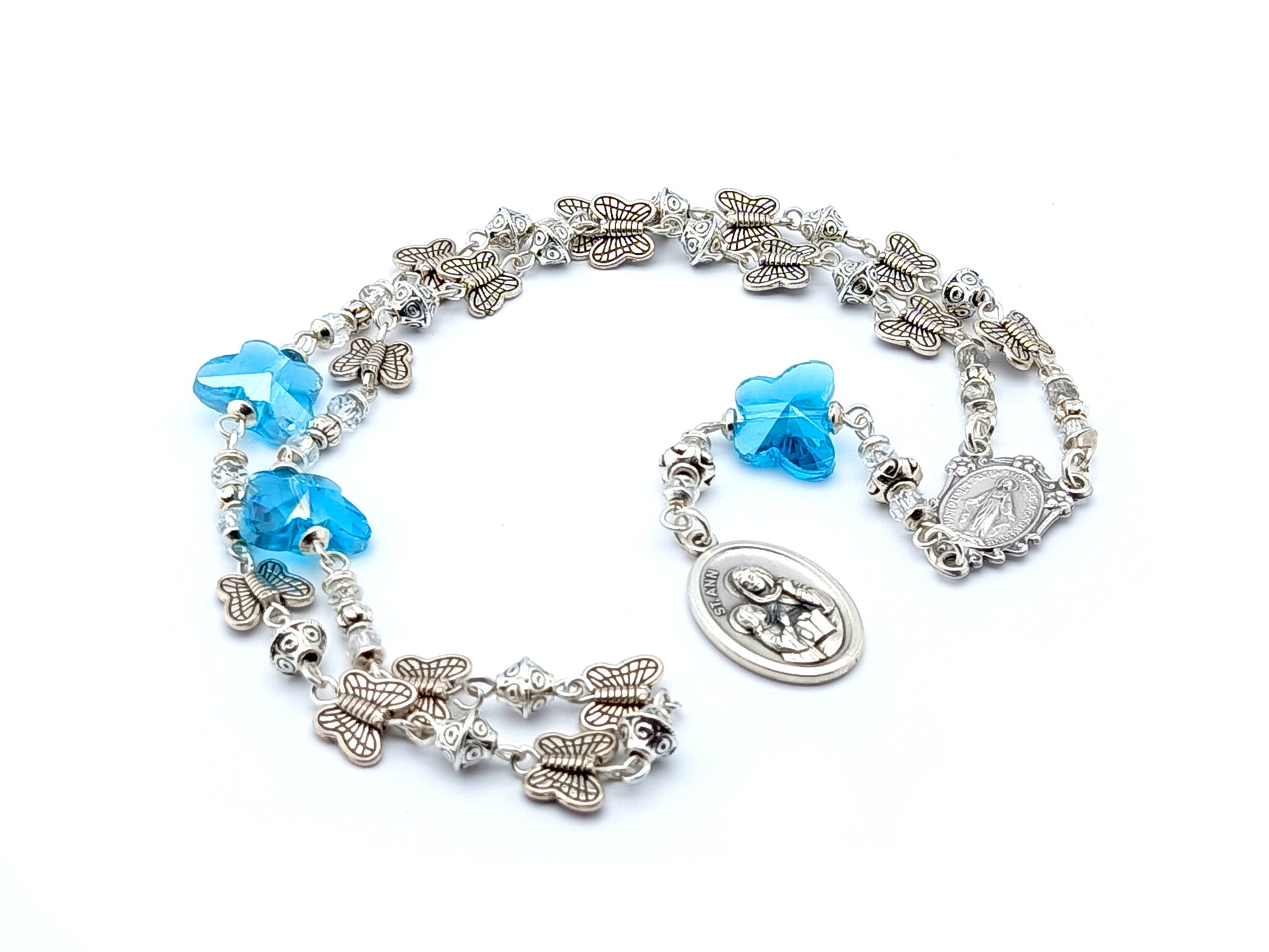 Saint Ann unique rosary beads prayer chaplet with silver butterfly and blue crystal beads, Miraculous medal centre and  Saint Ann end medal.