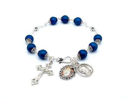 Saint Bernadette unique rosary beads prayer chaplet with blue glass and silver cross beads, silver crucifix and Our Lady of Lourdes picture medal.