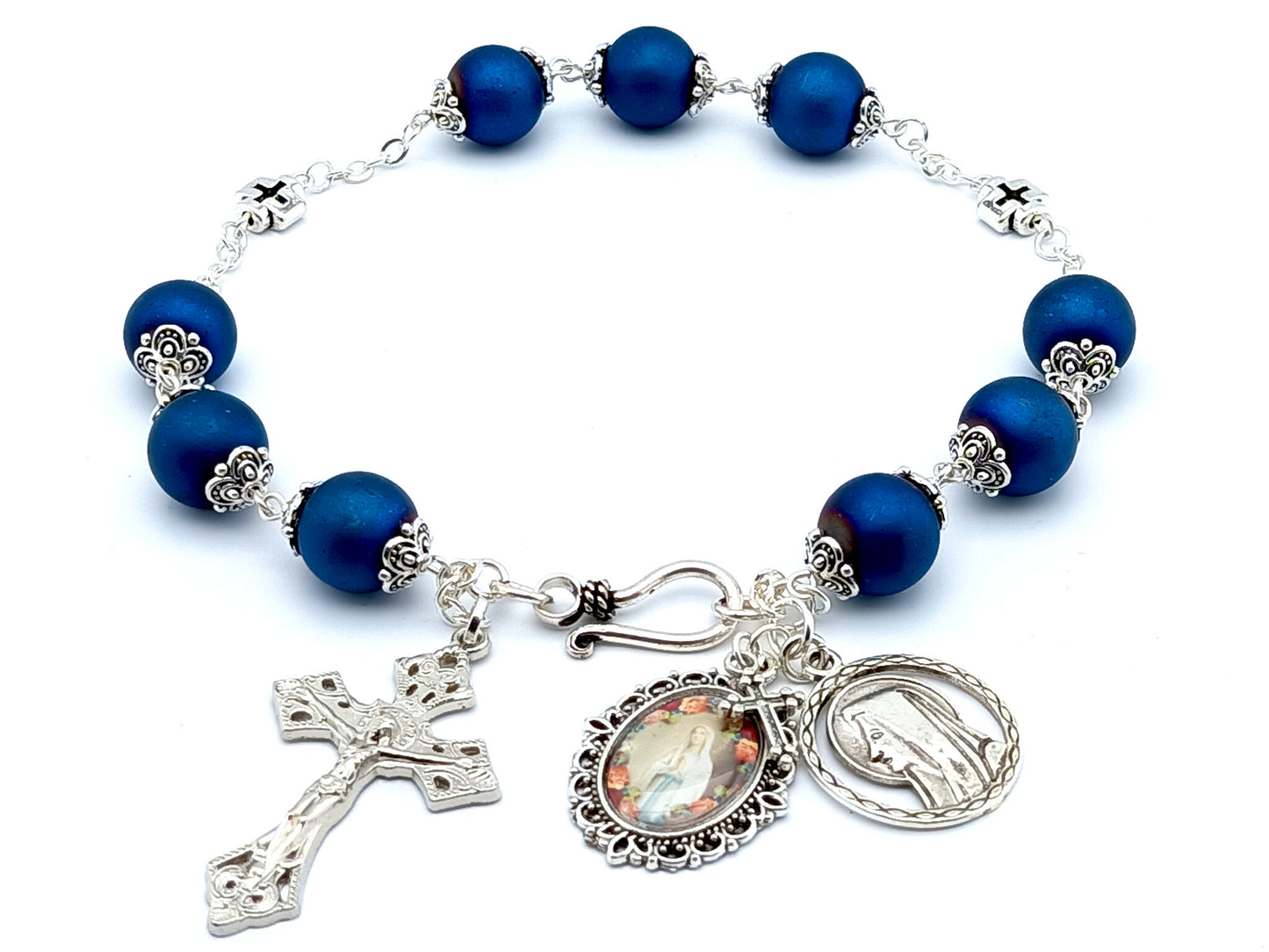 Saint Bernadette unique rosary beads prayer chaplet with blue glass and silver cross beads, silver crucifix and Our Lady of Lourdes picture medal.