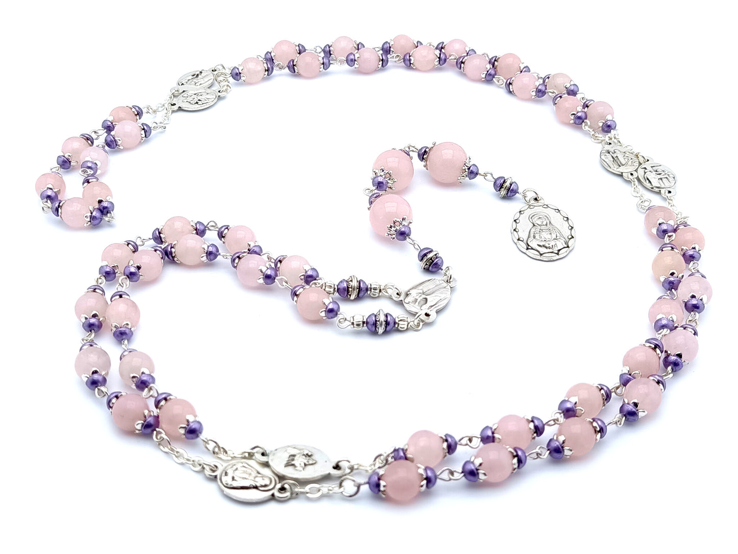Our Lady of Sorrows unique dolor rosary beads with pale pink glass beads, silver dolour medals and purple bead caps. 