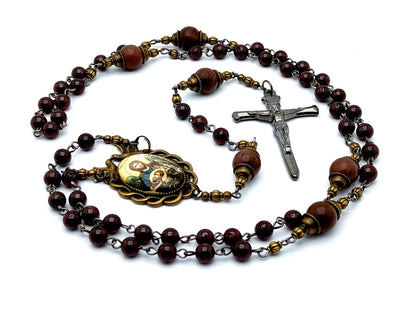 Antique style Saint John the Baptist unique rosary beads with garnet gemstone beads and nail crucifix and Holy Spirit domed center medal.