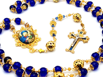 Our Lady of Perpetual Help unique rosary beads with blue glass and gold plated Our Father beads and blue enamel Saint Benedict crucifix.