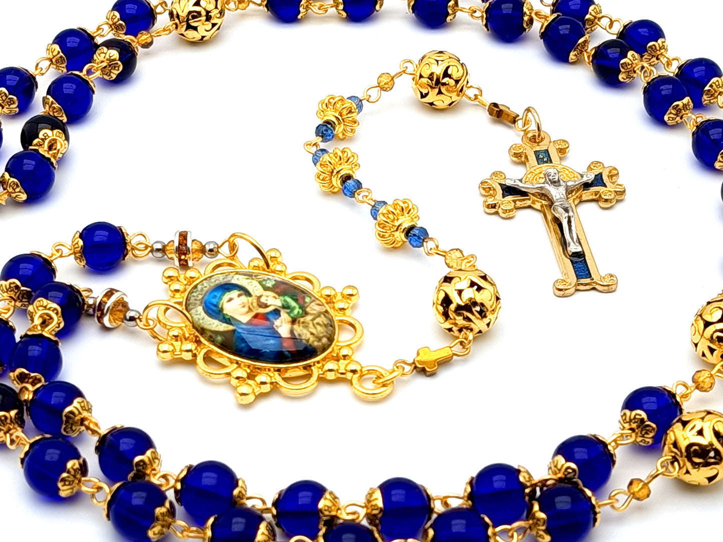 Our Lady of Perpetual Help unique rosary beads with blue glass and gold plated Our Father beads and blue enamel Saint Benedict crucifix.