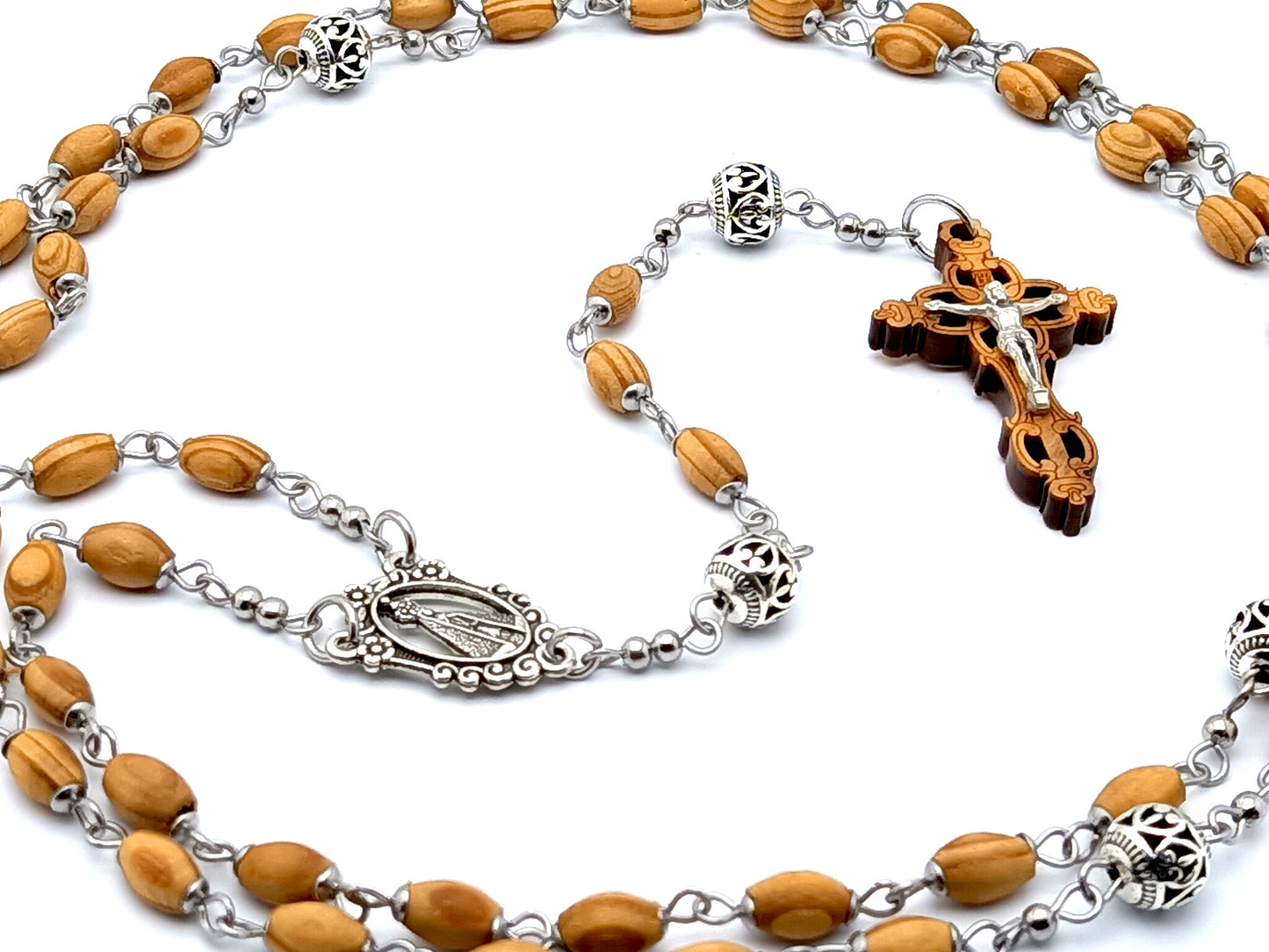 Our Lady of Charity unique rosary beads with wooden and Tibetan silver beads and Jerusalem olive wood laser cut crucifix.