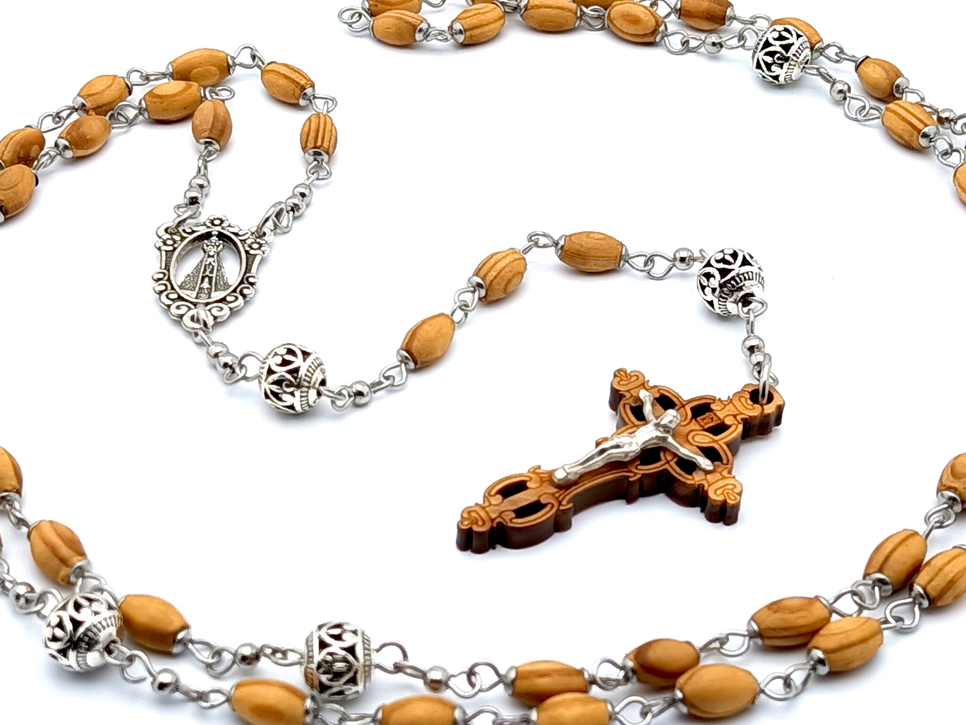 Our Lady of Charity unique rosary beads with wooden and Tibetan silver beads and Jerusalem olive wood laser cut crucifix.