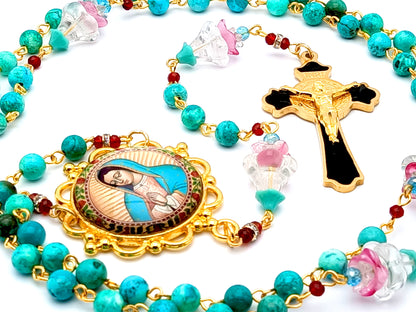 Our Lady of Guadalupe unique rosary beads with turquoise gemstone and glass flowers beads and gold and black enamel Saint Benedict crucifix.