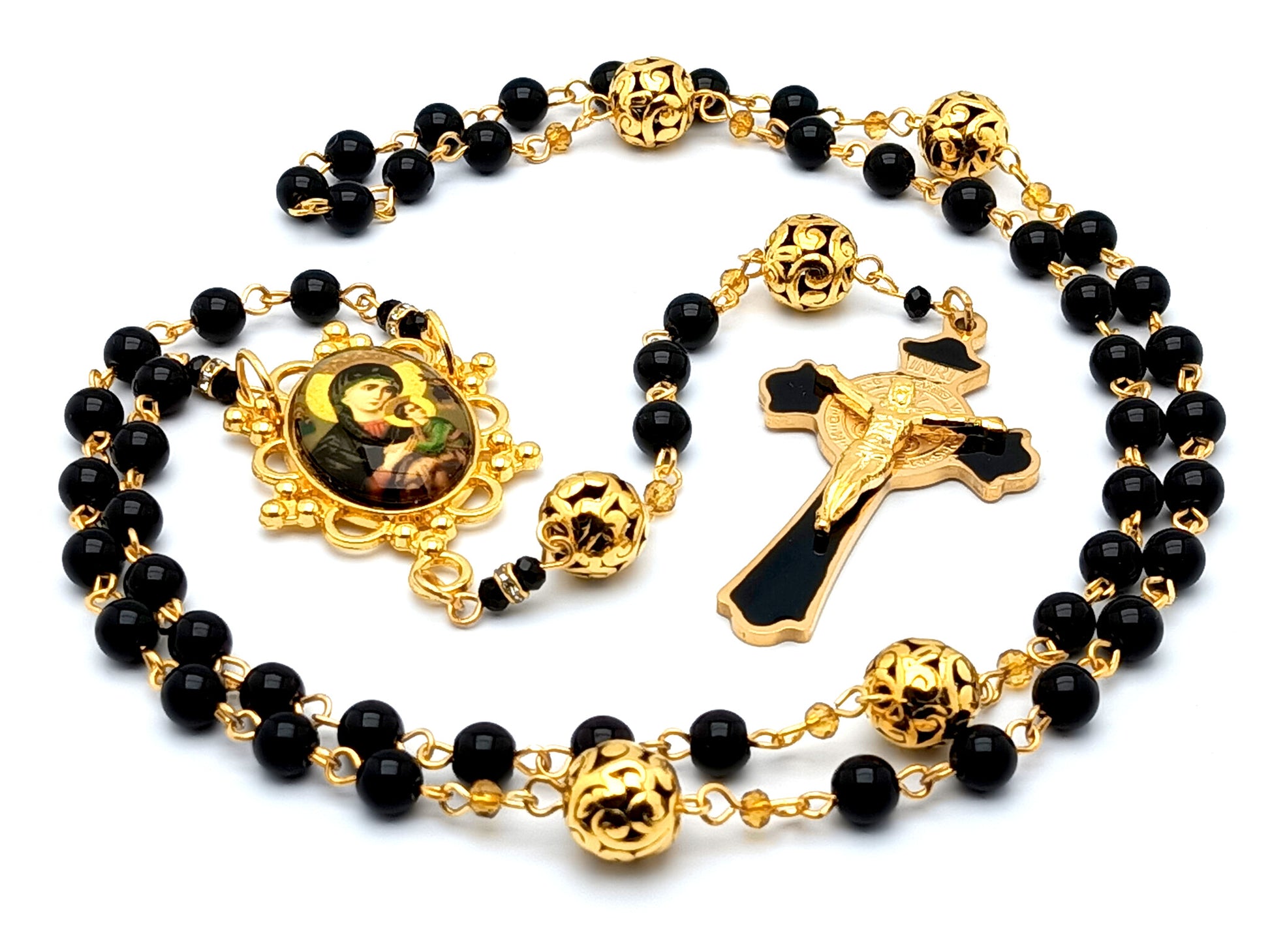 Our Lady of Perpetual Help unique rosary beads with gold and onyx gemstone beads and black enamel Saint Benedict stainless steel crucifix.