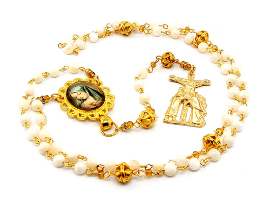 Our Lady of Sorrows unique rosary beads with mother of pearl and gold filigree beads and gold Saint John and Mary crucifix.
