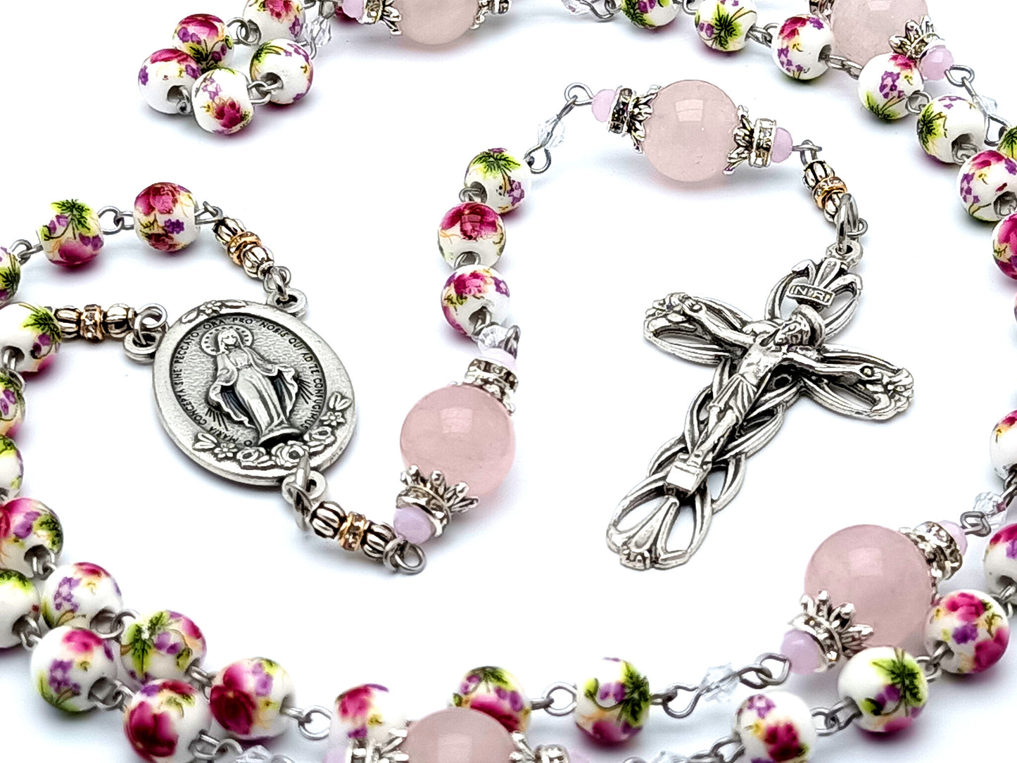 Miraculous medal unique rosary beads with floral porcelain and rose quartz gemstone beads and lily crucifix.