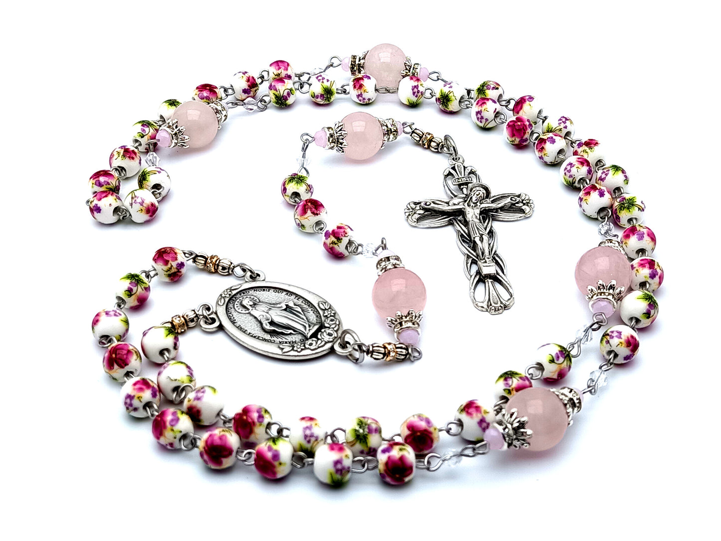 Miraculous medal unique rosary beads with floral porcelain and rose quartz gemstone beads and lily crucifix.