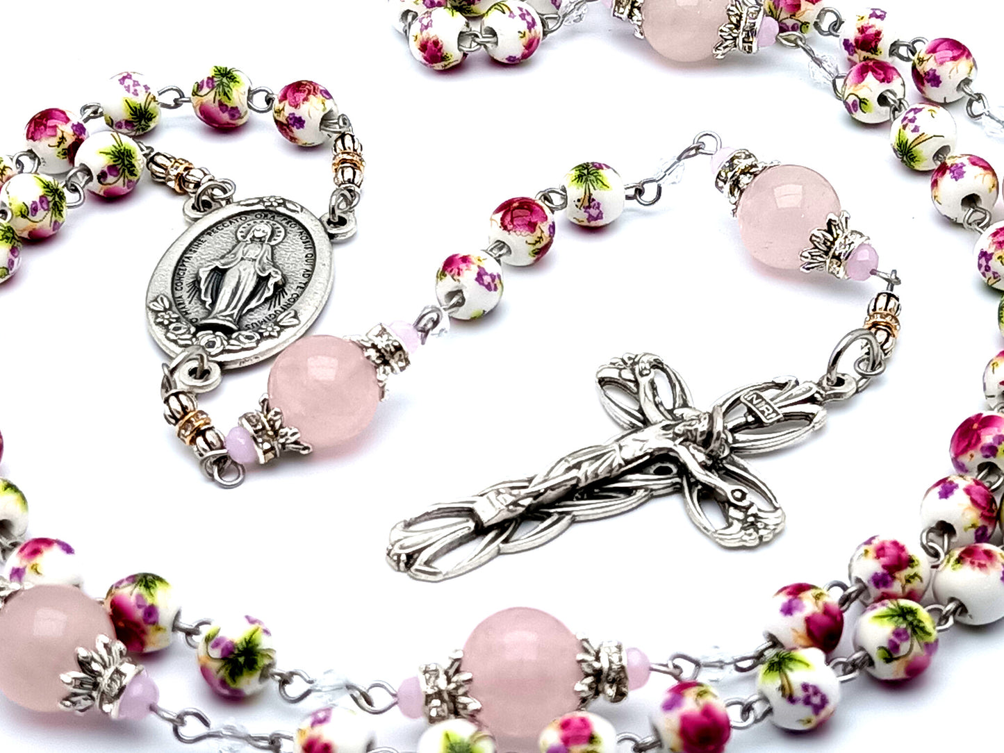 Miraculous medal unique rosary beads with floral porcelain and rose quartz gemstone beads and lily crucifix.