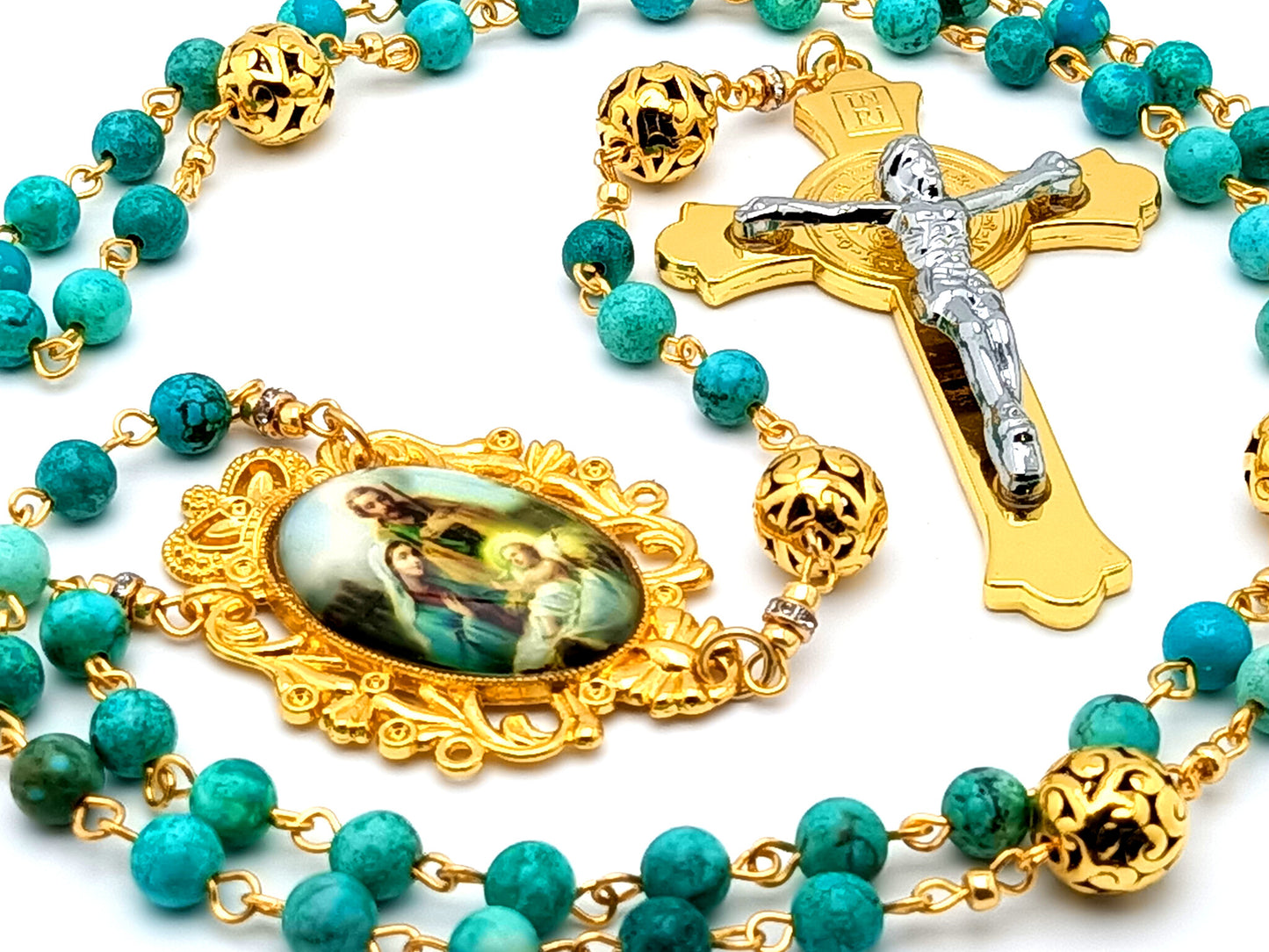 The Nativity unique rosary beads with turquoise gemstone and gold plated Bali beads and Holy Family medal and Saint Benedict gold and silver crucifix.
